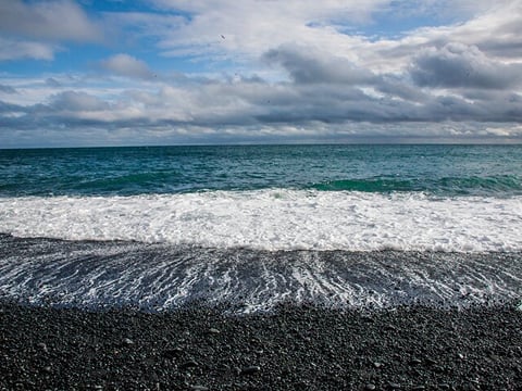 Oceanic wave on the black sand beach of Reynisfjara