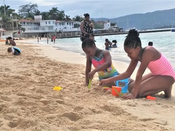 Building Sand Castles at Doctor's Cave Beach