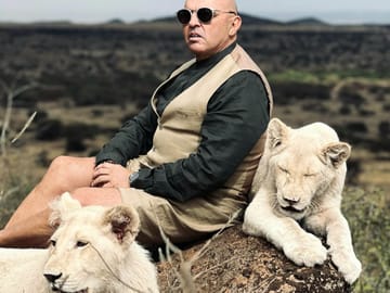 Private white lion encounter within an exclusive sanctuary.