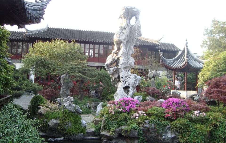 Shanghai to Suzhou by bullet train visit gardens and canal tour.