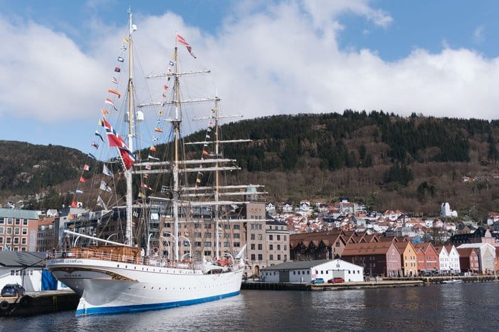 Tall sailing ship moored beside Bergen's historic waterfront