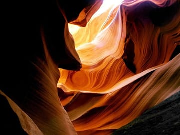 Light plays on the sandstone walls