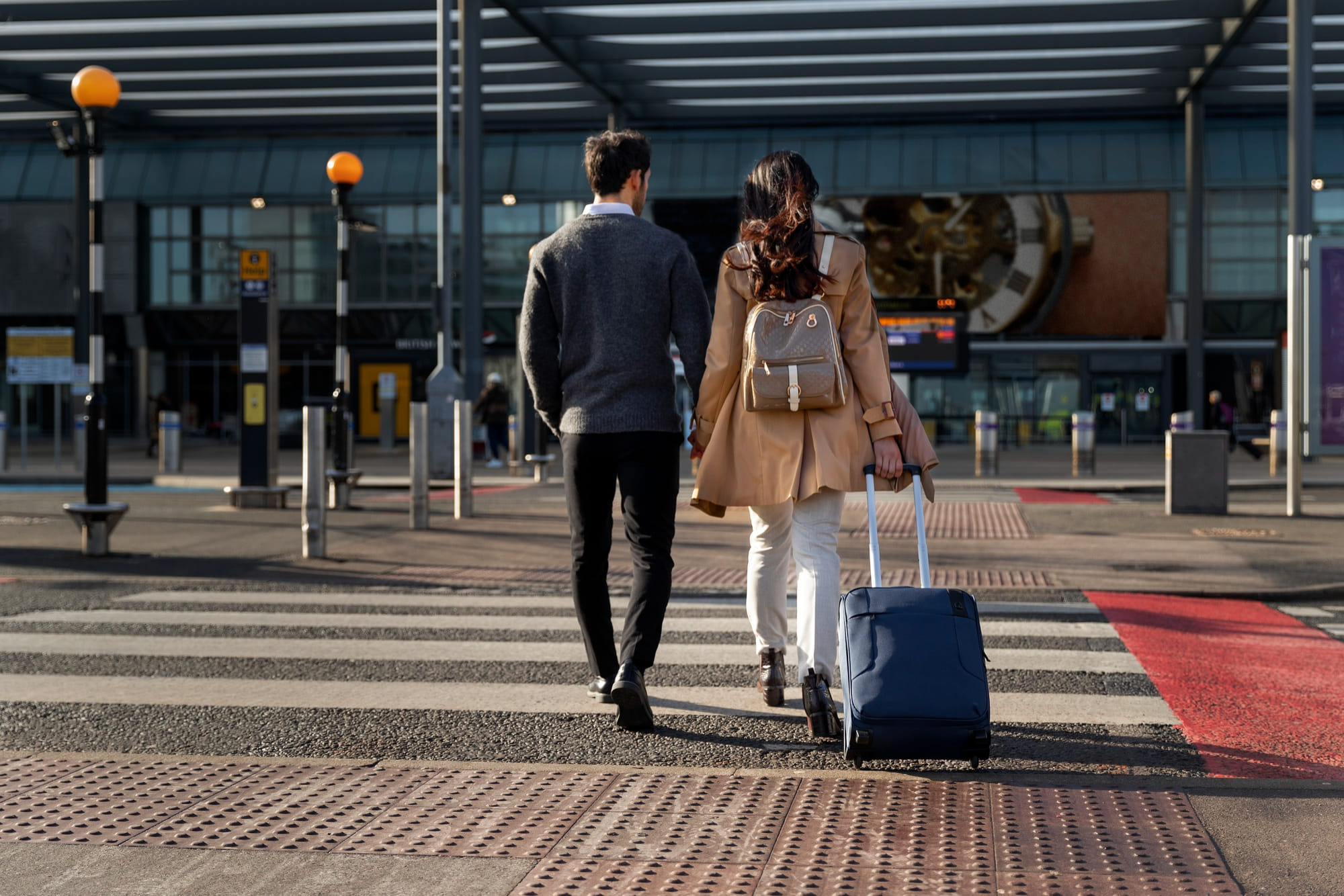 Couple with luggage at Krakow Balice Airport KRK private transfer pickup
