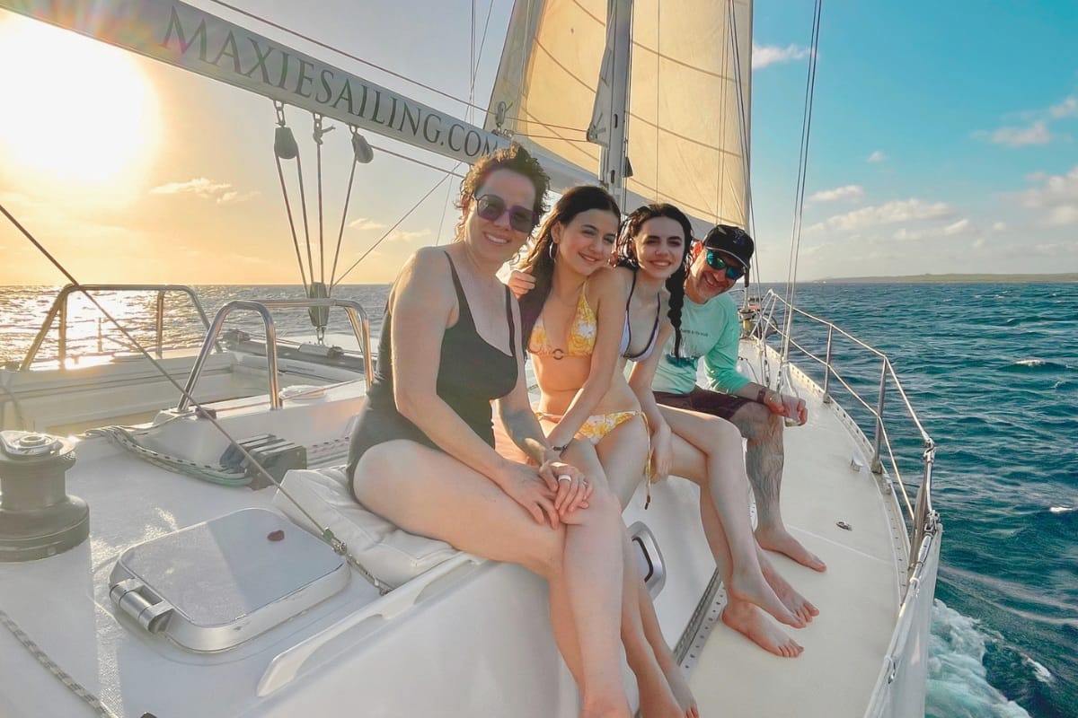 Family enjoying sailing Caribbean Sea at sunset by Maxie Sailing in Curacao