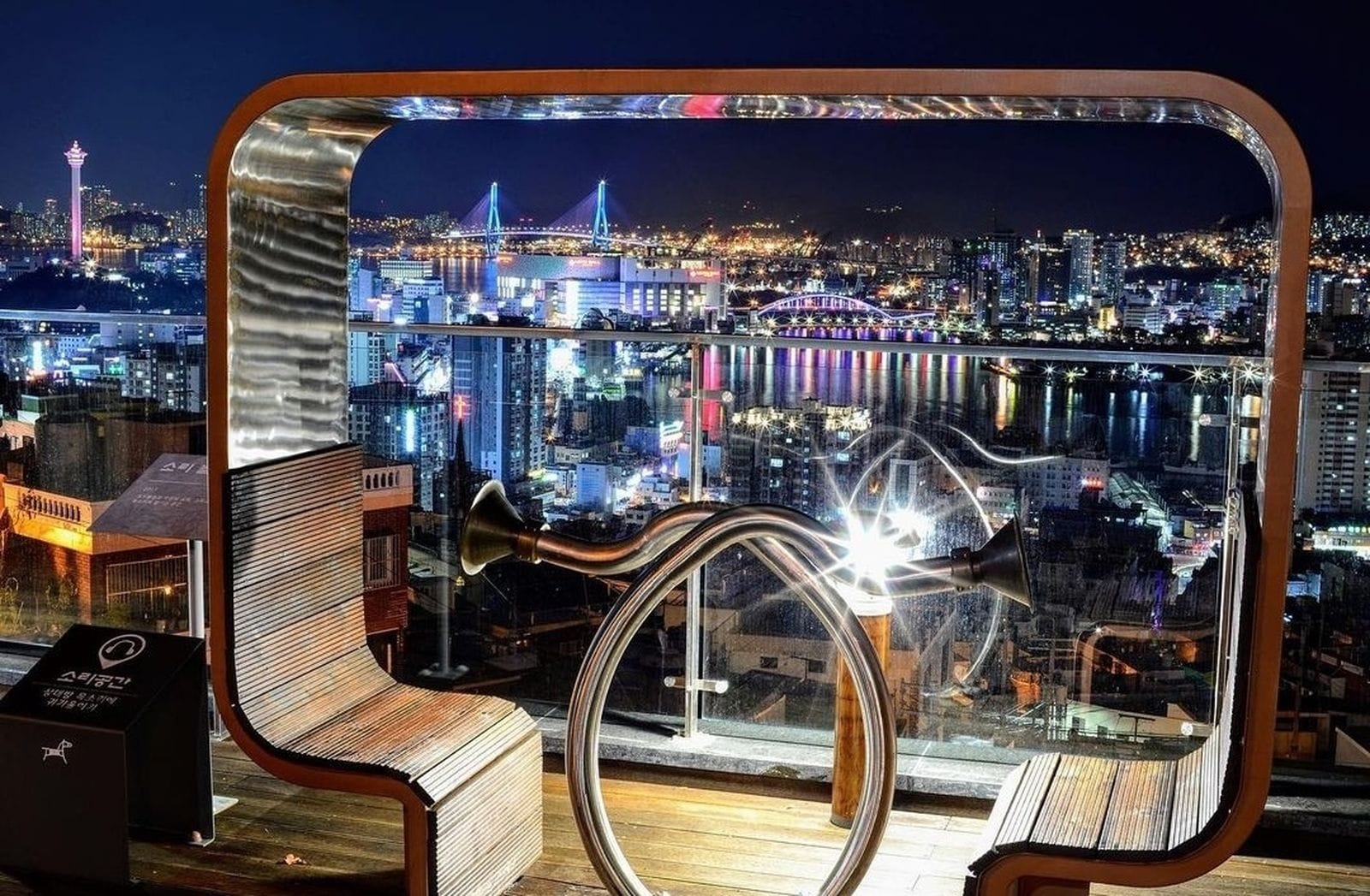 Cheonmasan Observatory night view overlooking Busan harbor and bridges.