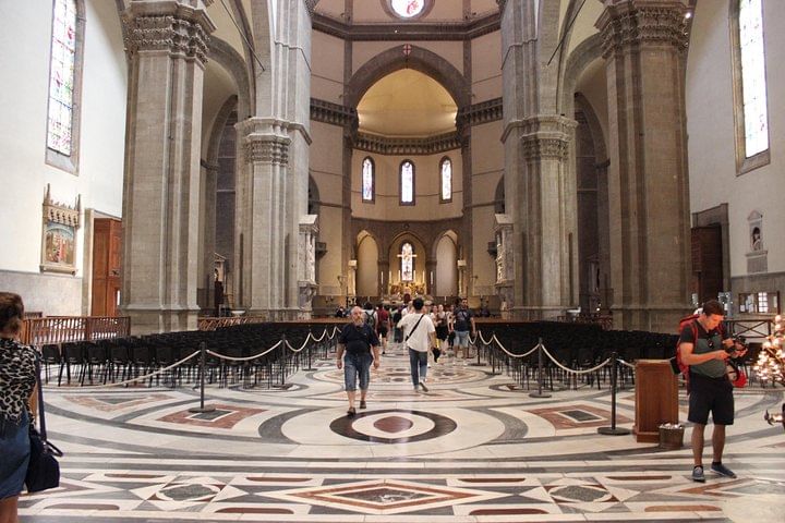 Wide view of the central nave of Santa Maria del Fiore Cathedral with the apse in the background