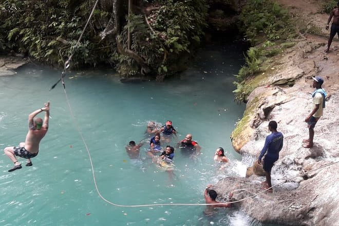 Visitors doing the rope swing