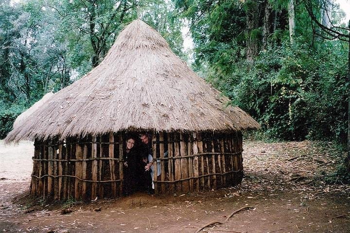 getting in a traditional hut