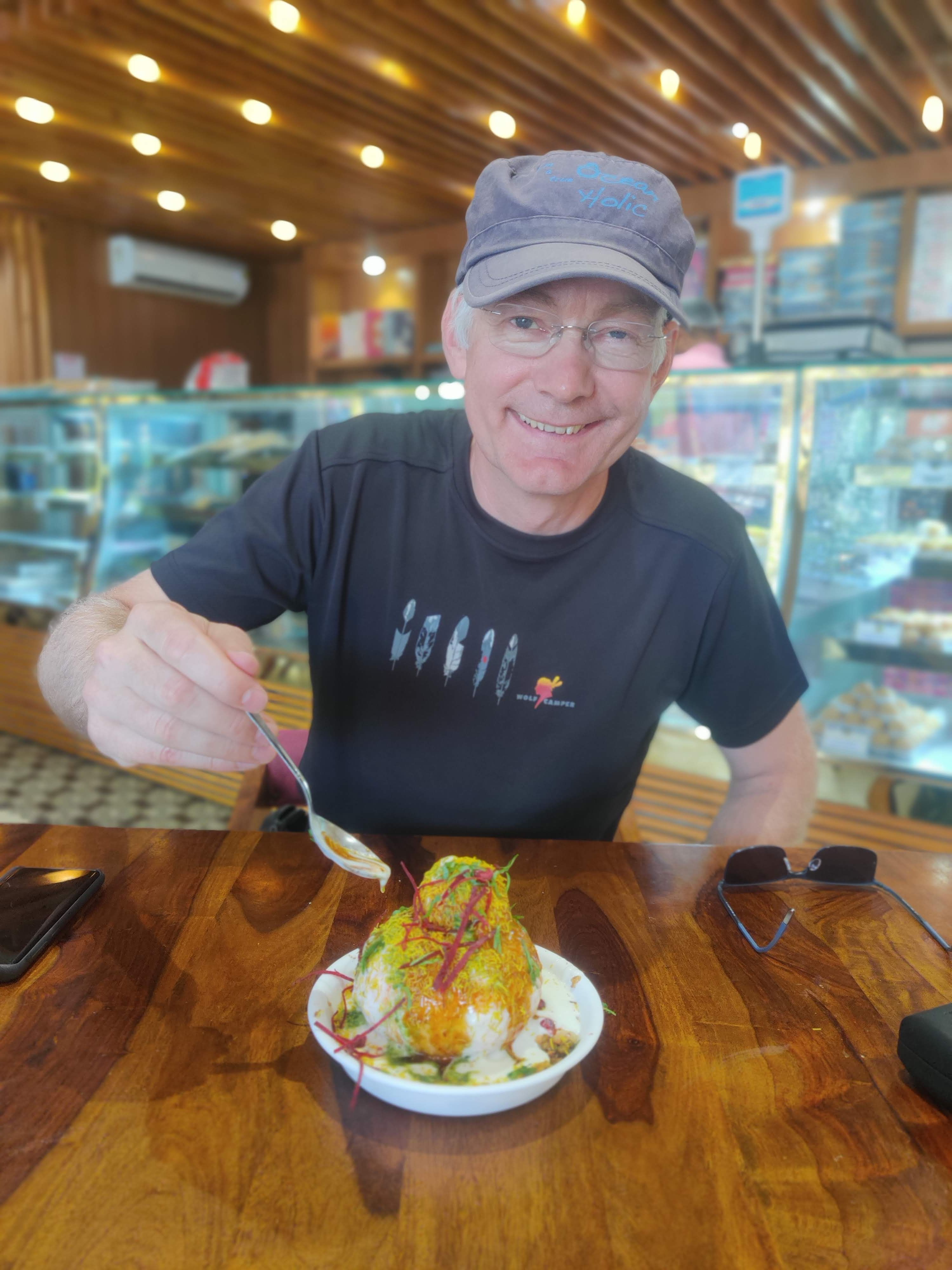 A white tourist is tasting Raj Kachori in Jaipur