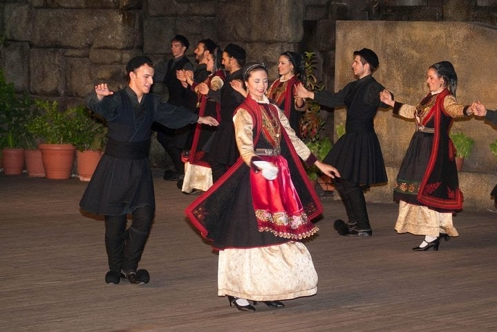 Dancers performing in traditional Greek costumes