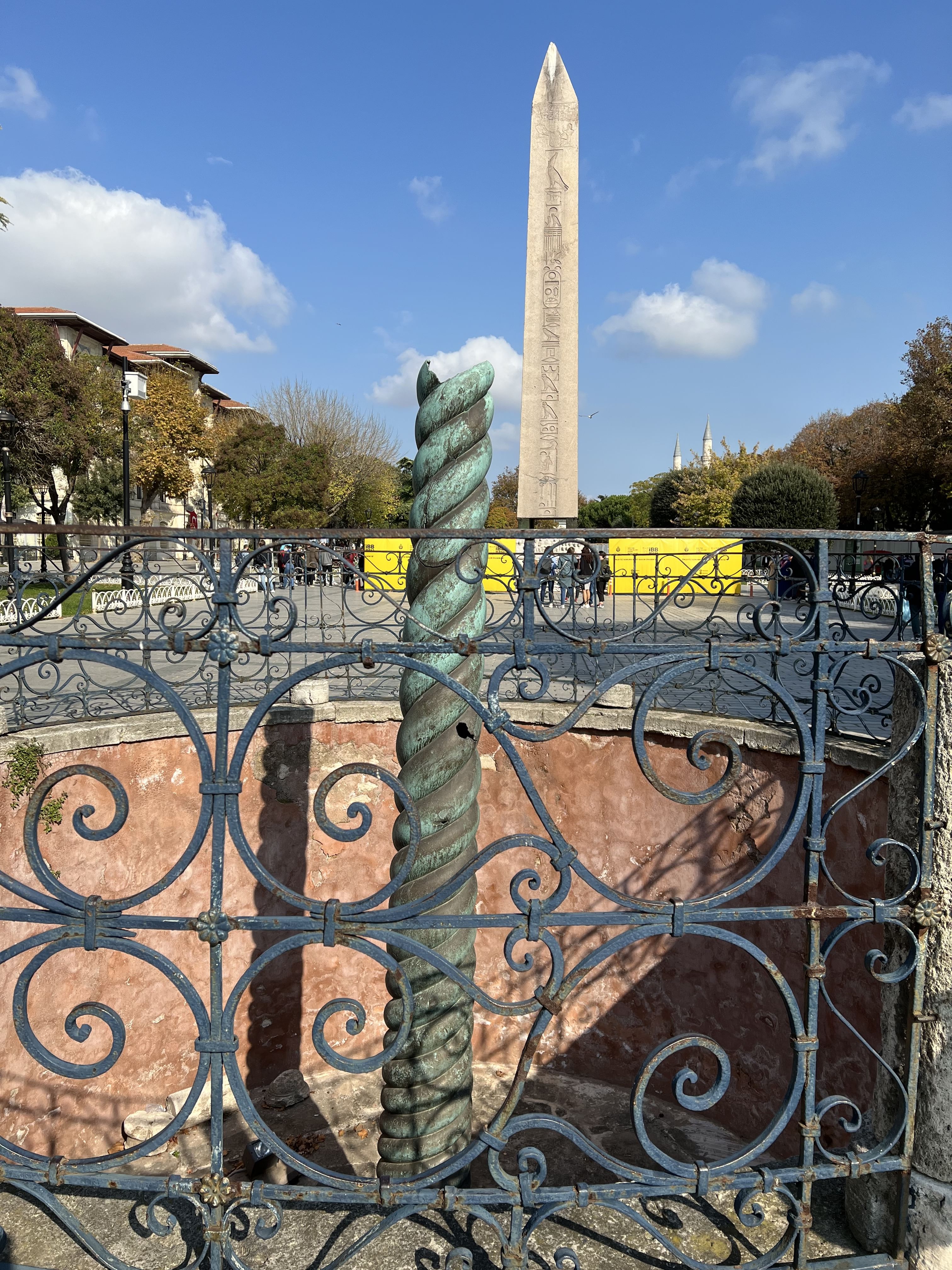 “View of Istanbul’s Hippodrome showing the ancient Serpent Column and Theodosius Column standing tall in an open square.”
