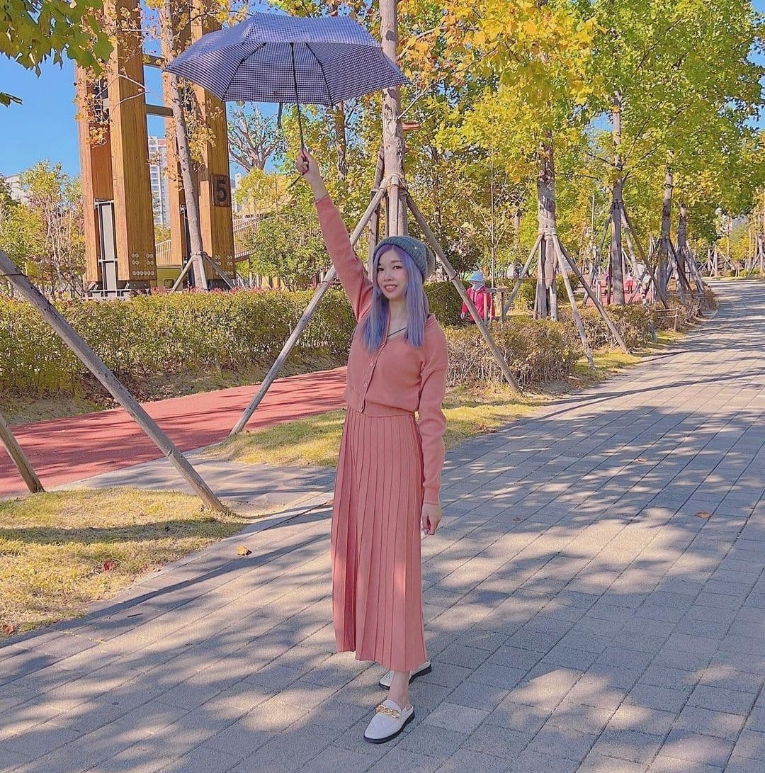 Traveler recreating BTS V’s famous photo pose at Busan Citizens Park.