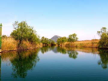 Sip local wine as you admire the serene beauty of the Crnojevića River and its hidden gems.