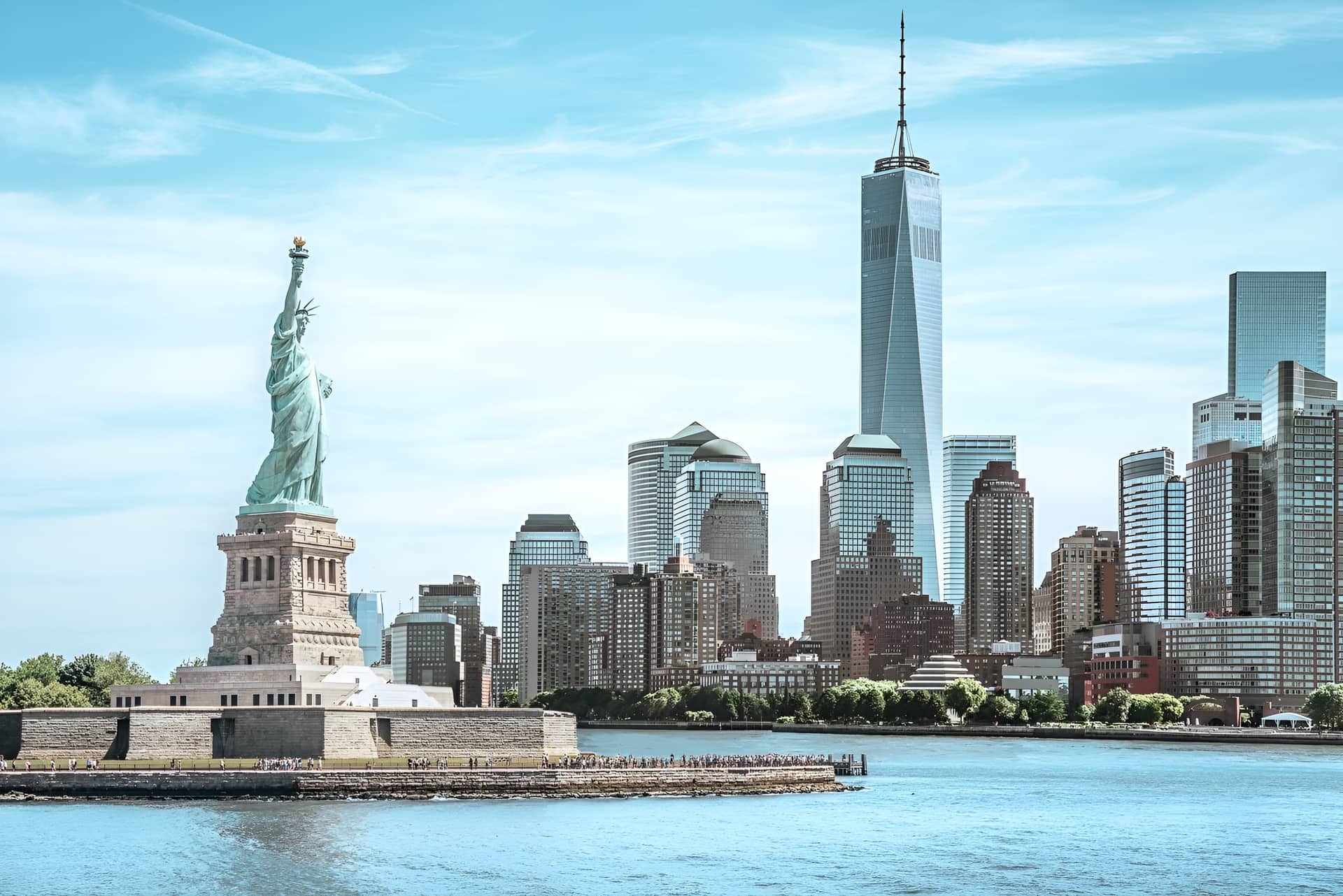 The Statue of Liberty and the Lower Manhattan skyline seen from New York Harbor