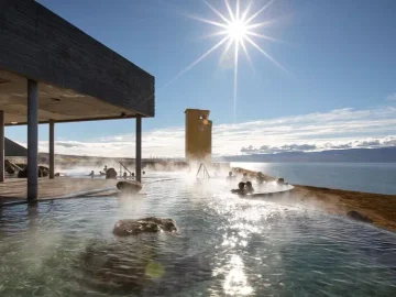 Relax in the geothermal infinity pools of GeoSea Baths overlooking the Arctic Ocean