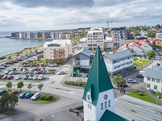 Drone shot showing streets and nearby natural scenery