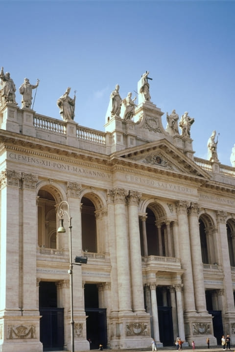 Feel the scale of Rome: sunlit marble, towering statues, and a timeless tradition that surrounds you as you step inside.
