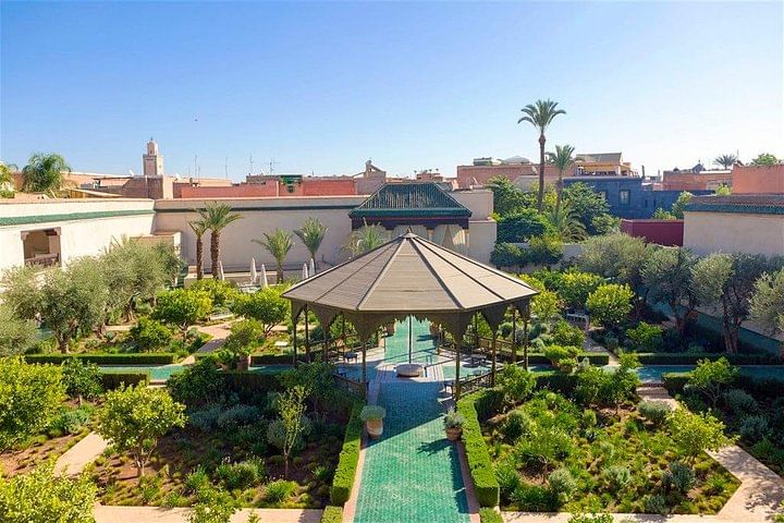 Les Jardins Secrets in Marrakech is a restored 19th-century garden offering a peaceful escape with lush greenery, intricate fountains, and traditional Moroccan architecture. It showcases Islamic and e