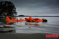 Open water or with ice. Try to float in ice cold water staying warm and dry in complete silence.