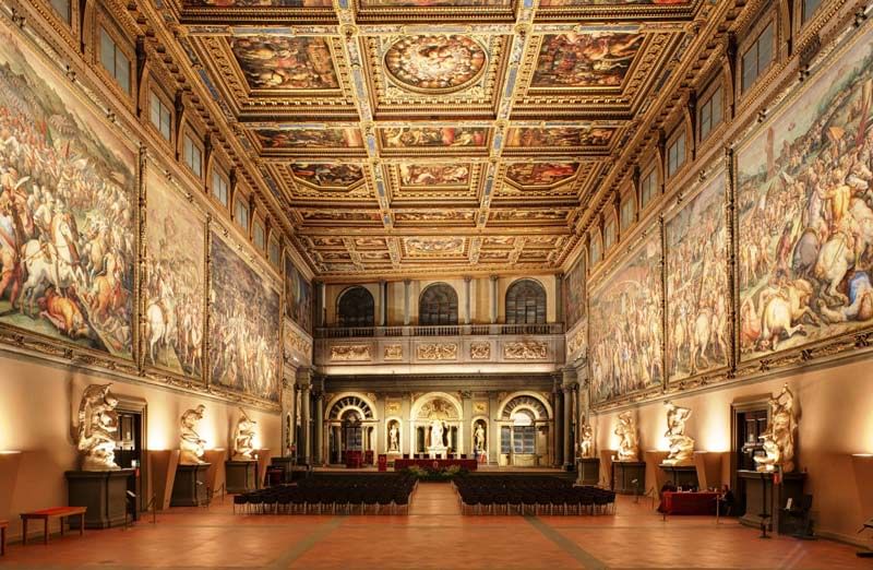 Salone dei Cinquecento inside Palazzo Vecchio, with its decorated ceiling and frescoed walls