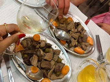Pica Pau is a traditional Portuguese dish consisting of small pieces of marinated pork or beef, typically served with a spicy sauce and pickles.