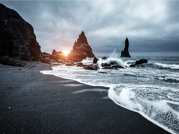 Reynisfjara, the Black Beach, is a truly unique spectacle of nature. These rocks are called the "Troll Toes"