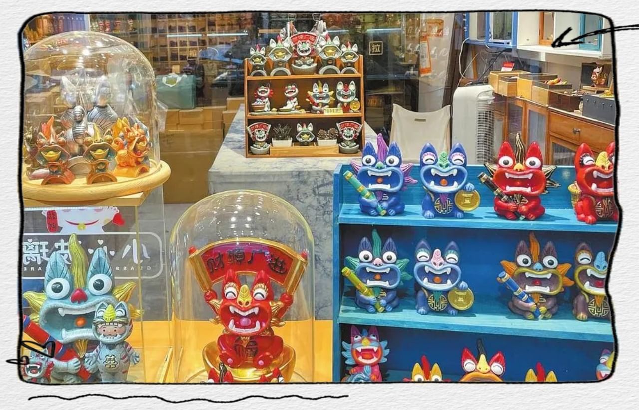 Colorful tile cat window display