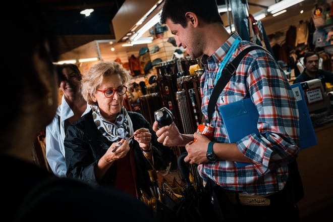 Travelers are introduced to yerba mate, a traditional Argentinean drink, by their guide in Buenos Aires.