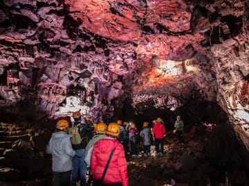 Visitors exploring Iceland’s underground lava world
