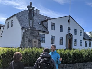 A tour group walking through downtown Reykjavik