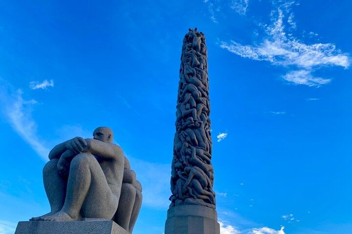 One of the sculptures around the base of the monolith, plus the monolith sculpture,  in Vigeland Park