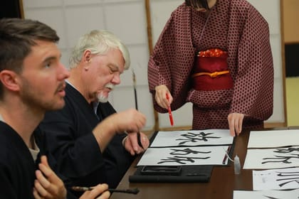 Learning Zen of Japanese Calligraphy in kimono near Osaka Castle