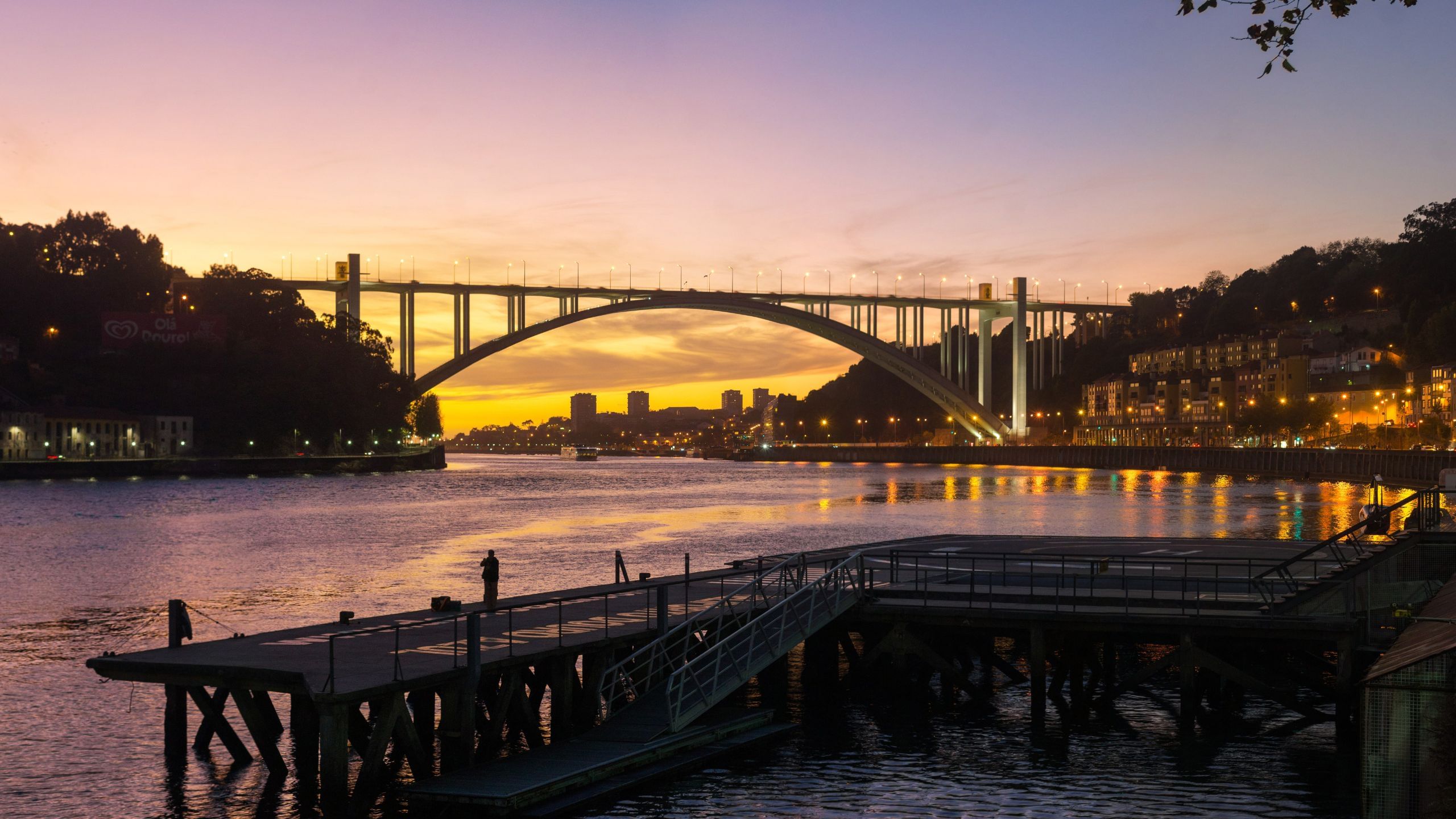 Closer view of the Douro River sunset and the Arrabida Bridge in Porto, part of Cooltour Oporto's Night Tour