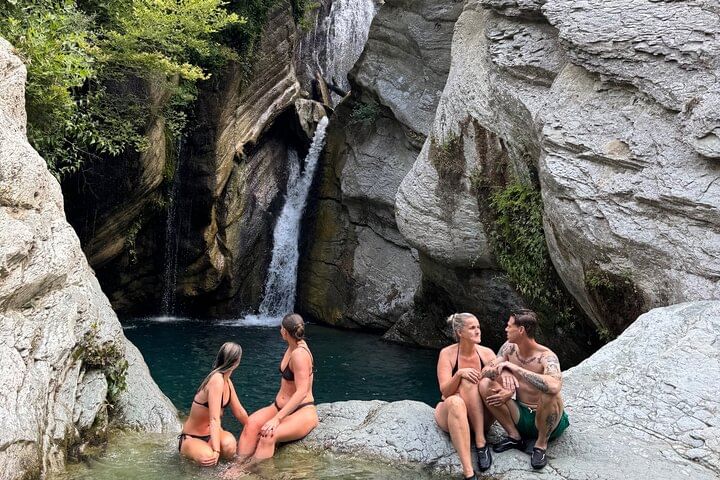 Swimming in the waterfall .