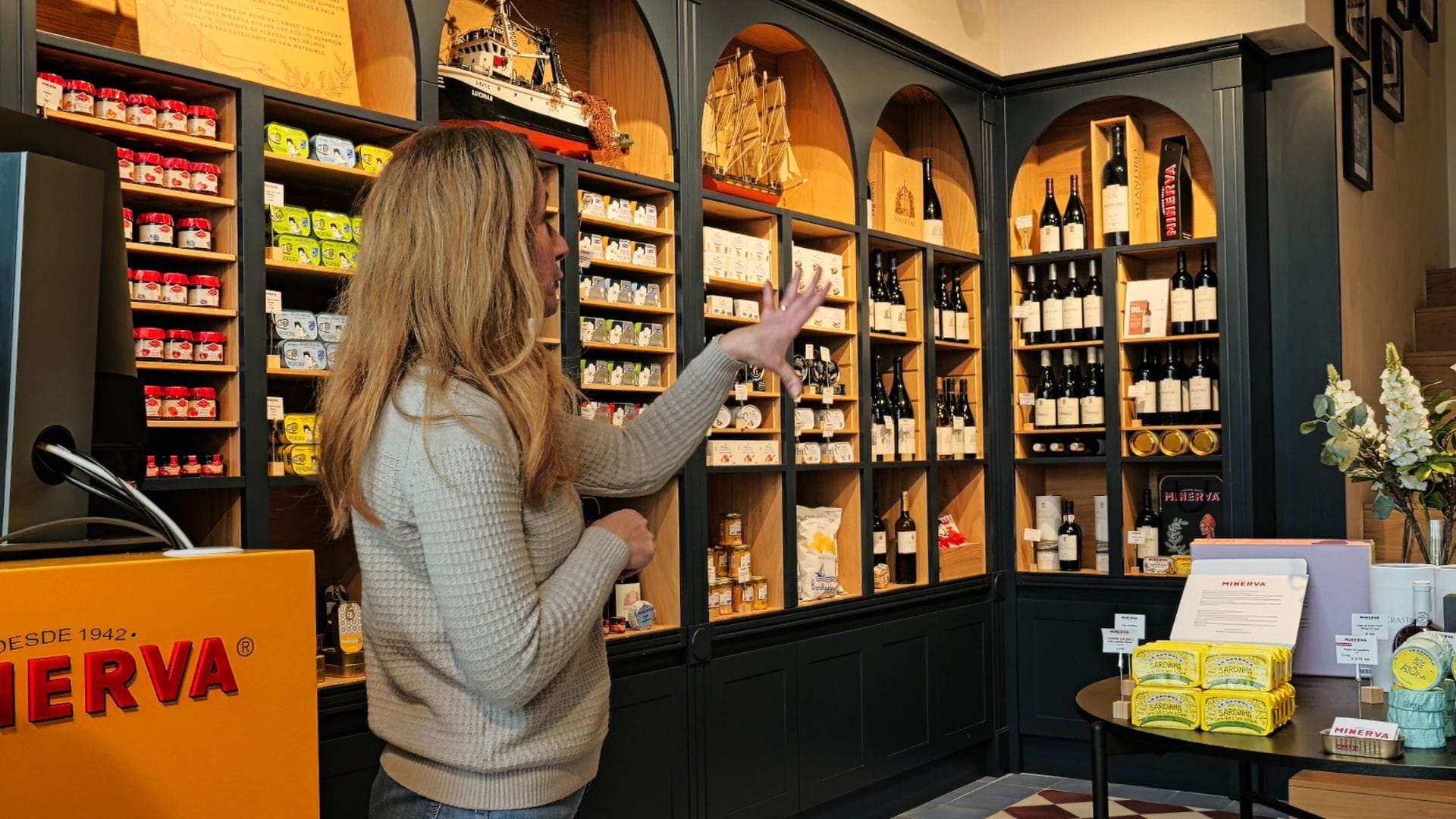 Group of guests tasting gourmet Portuguese fish conserves paired with Douro wine on a Cooltour Oporto experience