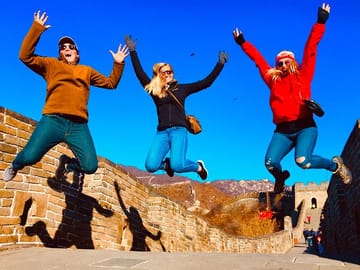 Jumping on the Great Wall of China.