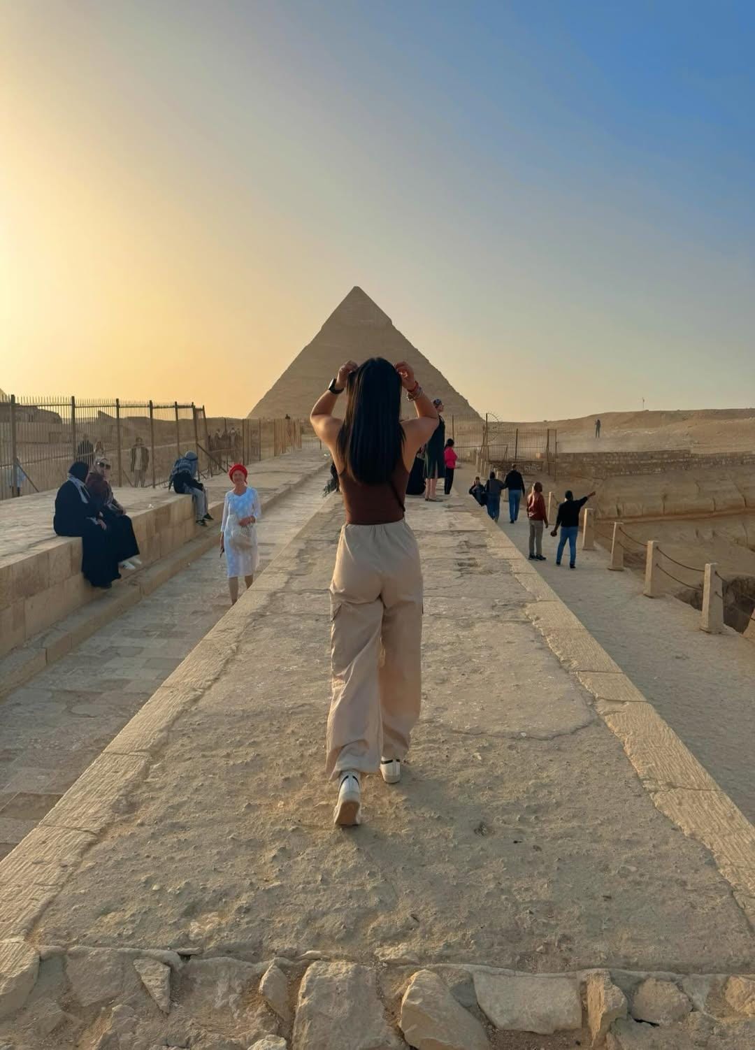 Traveler posing near Khafre Pyramid with Giza plateau in background – Cairo sightseeing image