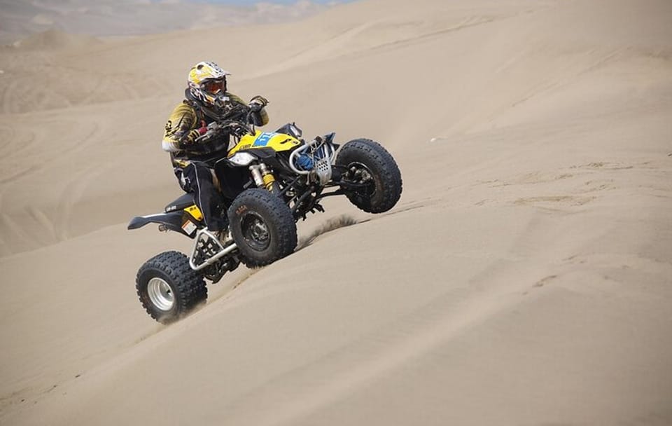 Experience Quad Bike, BBQ Dinner and Live Show in Dubai