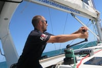 One of our professional skippers at work hoisting the sails