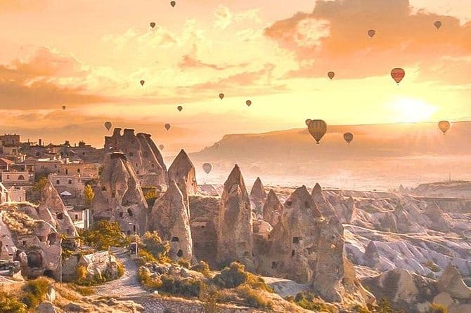 Cappadocia sunrise views — fairy chimneys and soft morning light over the valleys.