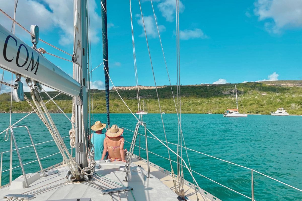 Romantic couple enjoying private sunset cruise in Curacao with Maxie Sailing