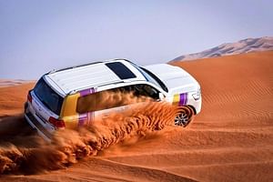 Dubai Desert Safari with BBQ And 4W Land Cruiser Dune Bashing Experience-Sandboarding