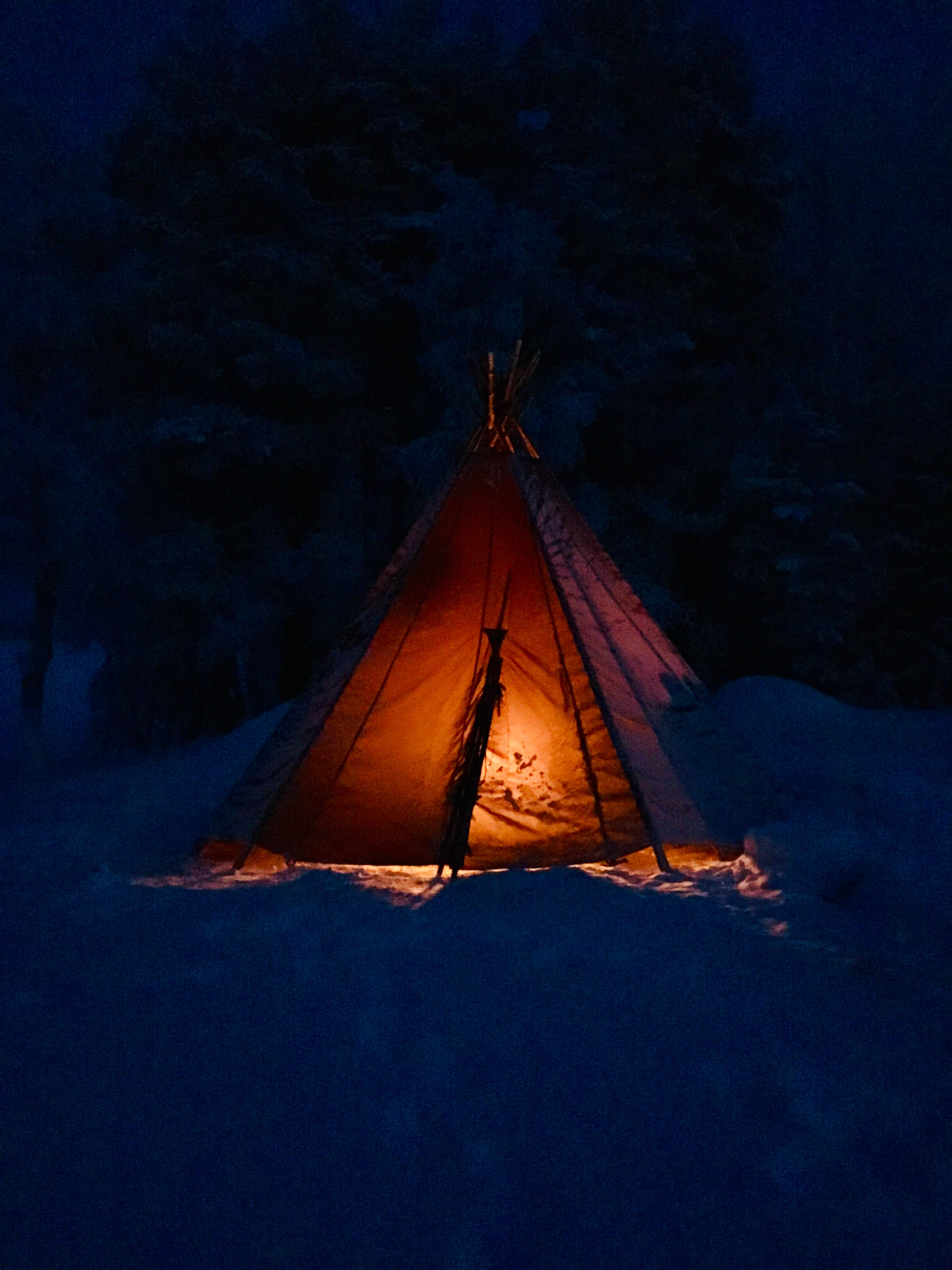 Step into the glowing warmth of our wilderness kota - the perfect Arctic shelter to relax and wait for the Northern Lights to appear