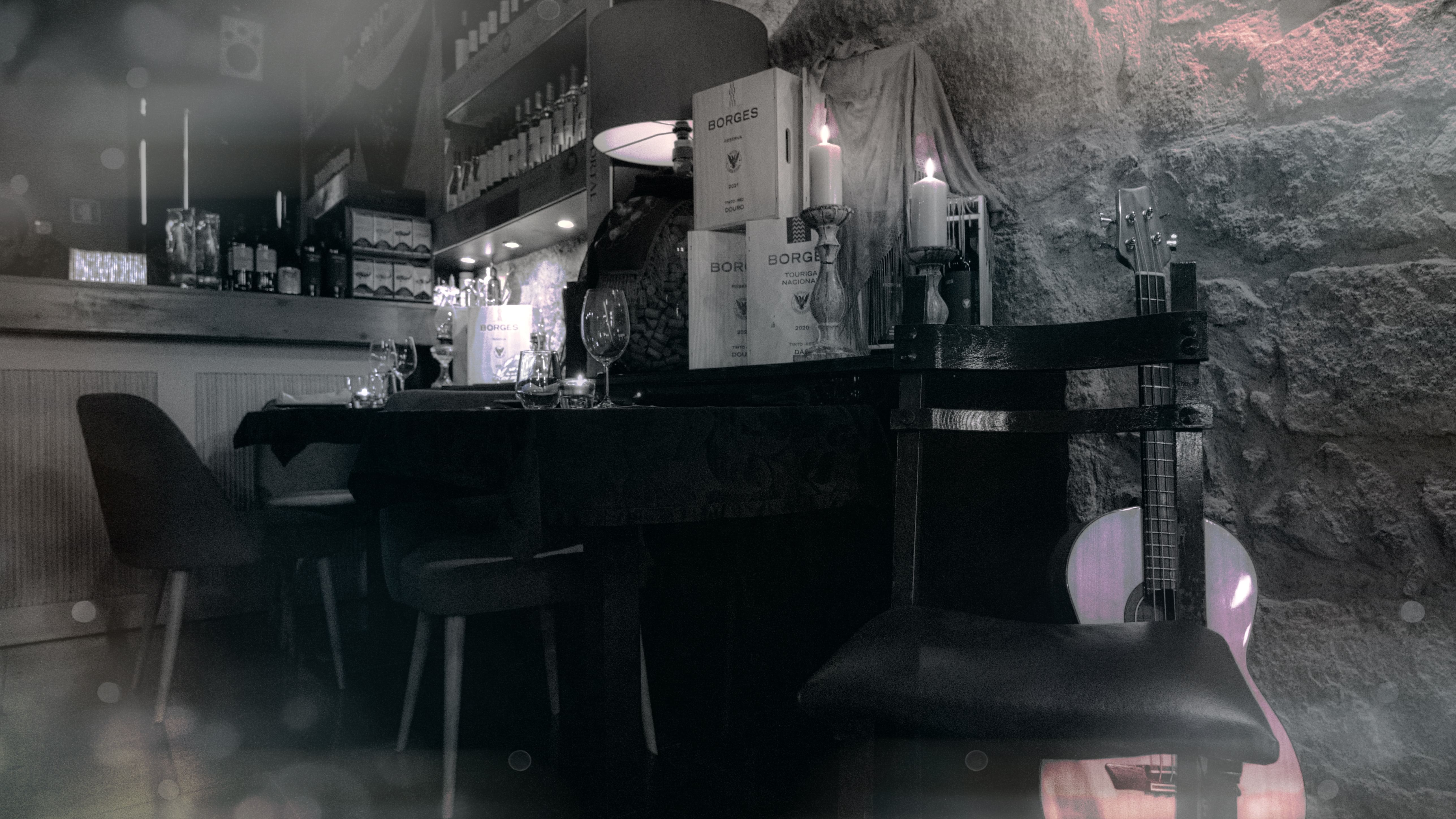 Image of a beautifully set table at a local restaurant in Porto, creating an intimate Fado atmosphere for Cooltour Oporto's Fado Dinner Show