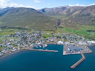 Dalvík harbor with mountains and boats in view