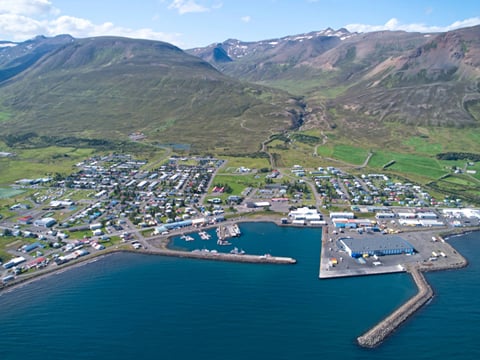 Dalvík harbor with mountains and boats in view