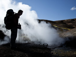 Hiker by one of the geothermal areas on the Laugavegur Volcano Trail. Photocredits: Alastair Humphries.