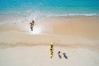 Aerial view kayak on beach crystal clear water two bays Los Cabos snorkeling tour