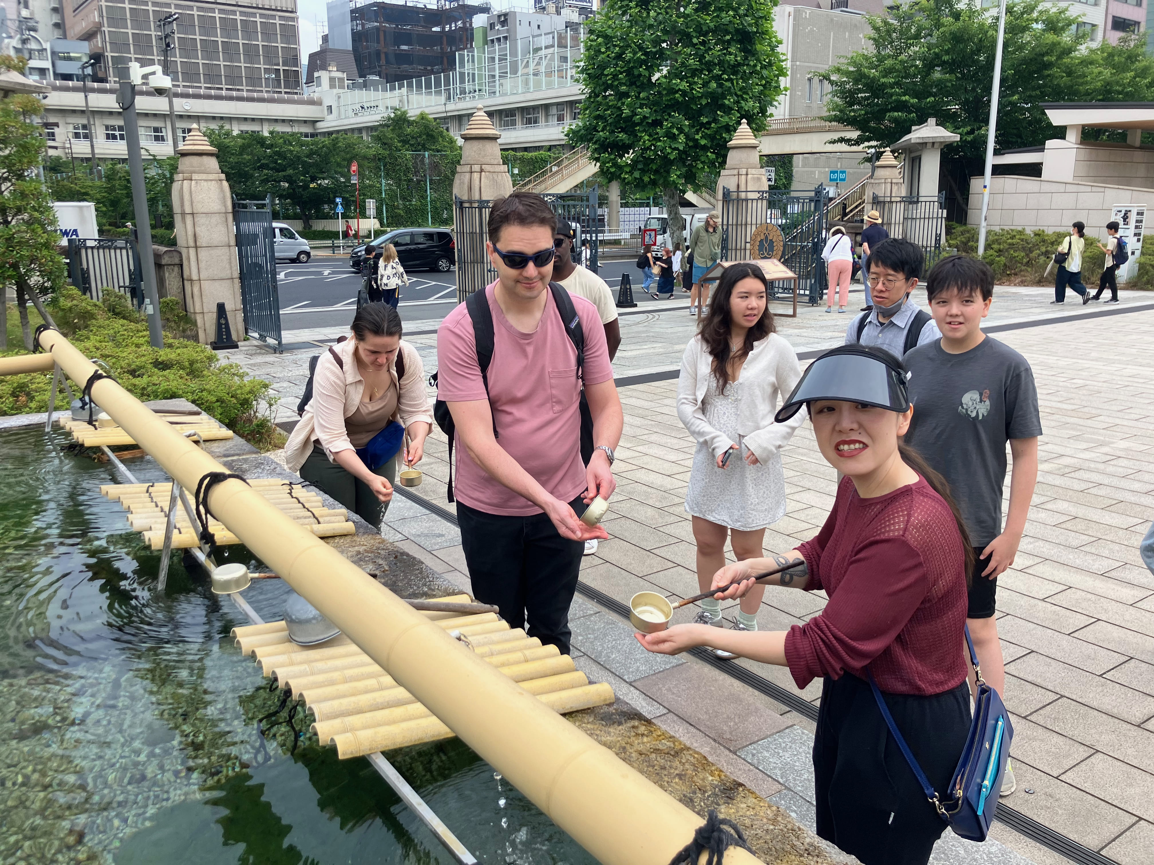 Guests purifying themselves outside Tsukiji Hongwanji temple