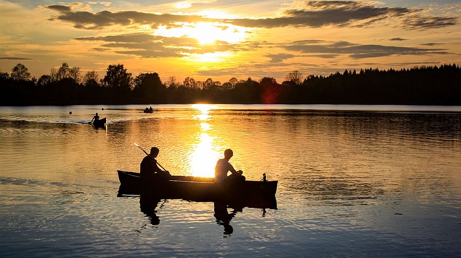 Canoeing under the Midnight Sun on a peaceful lake in Finnish Lapland